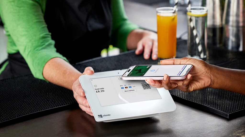 Consumer buying soft drinks using a Lloyds digital credit card on smartphone