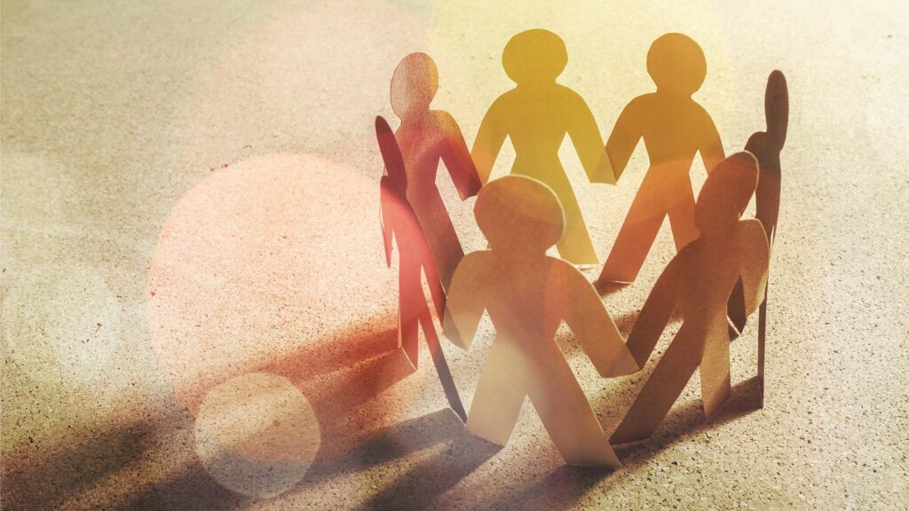 Cut out paper people grouped together